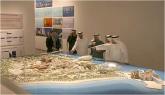 Visitors view the Saadiyat Island Cultural District model at the Emirates Palace in Abu Dhabi in 2007. The new Guggenheim museum is in the right foreground